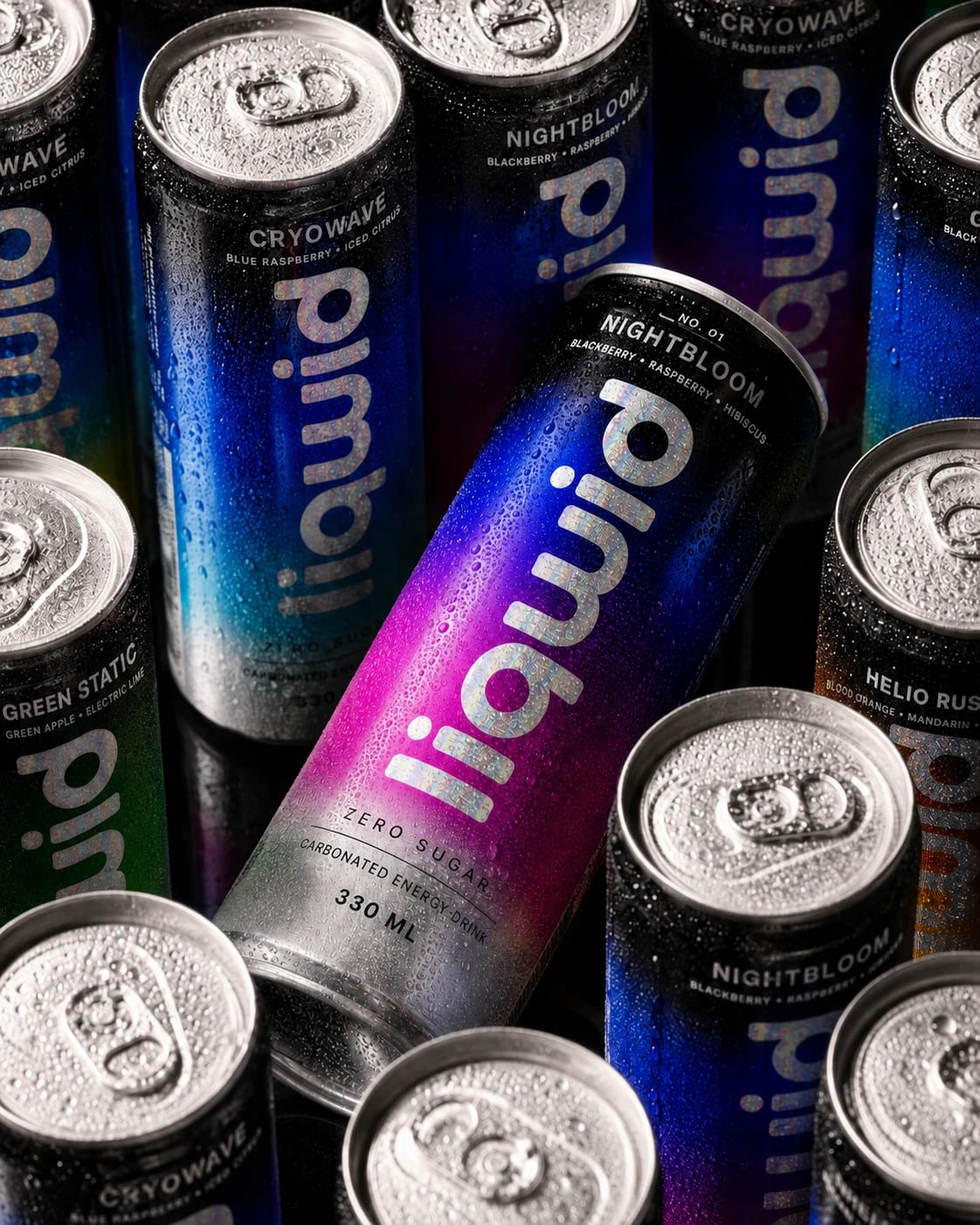 A close-packed collection of chilled LIQWID cans with bright holographic lettering and water-beaded silver lids.